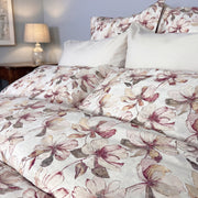 Close-up of Petals large magnolia floral print duvet cover in blush pink and mauve on white – soft percale cotton bedding by Cuddle Down